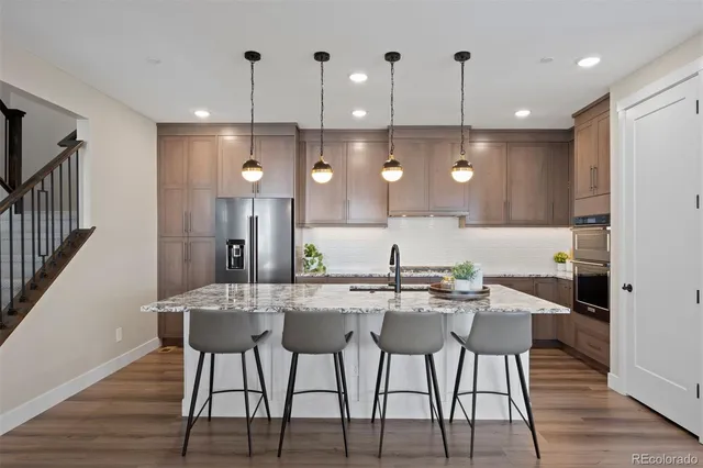 a kitchen with a table and chairs in it