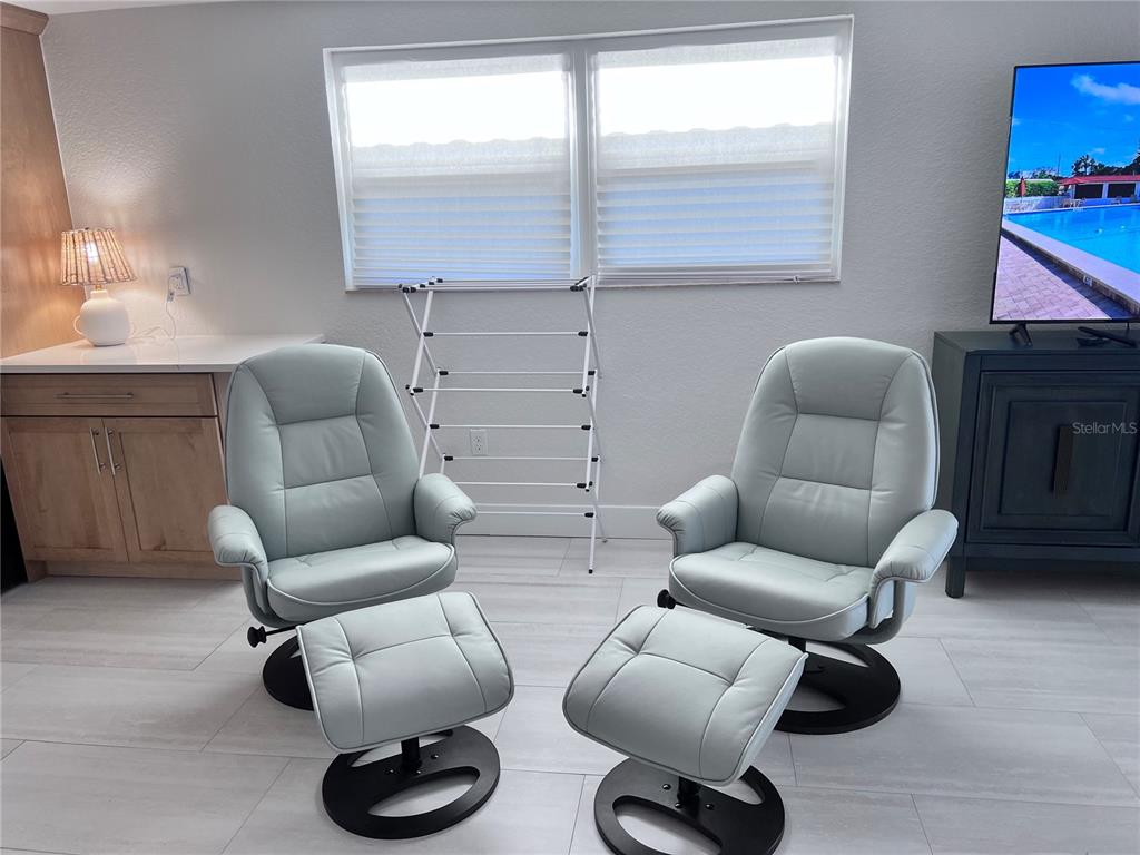 6154 Midnight Pass Road, Unit B06 Sarasota, FL 34242 - Photo 8 of 18 a living room with furniture and a window