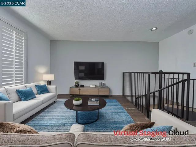 a living room with furniture and a table