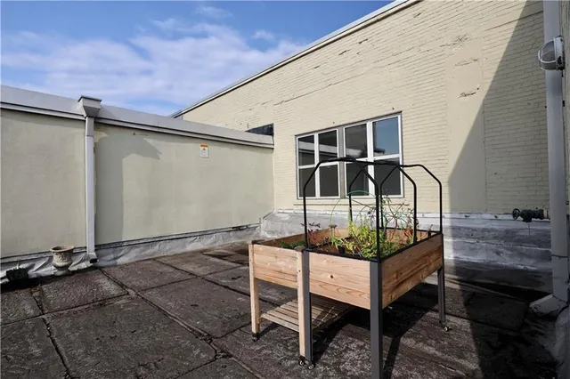 a backyard of a house with table and chairs