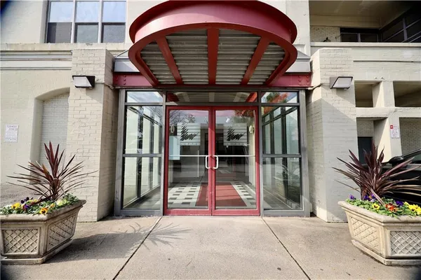 a view of a porch with potted plants