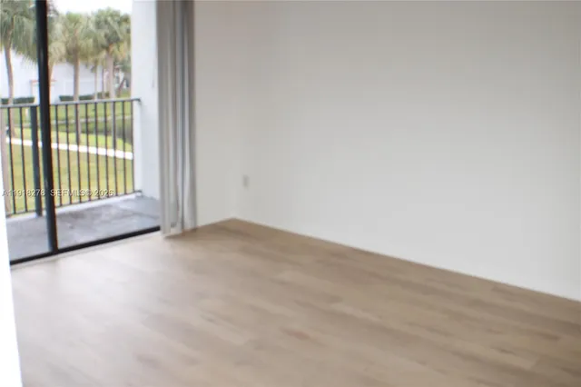 a view of a room with sliding glass door