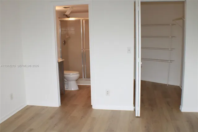 a view of a bathroom from a hallway