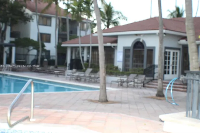 a view of a house with backyard and porch