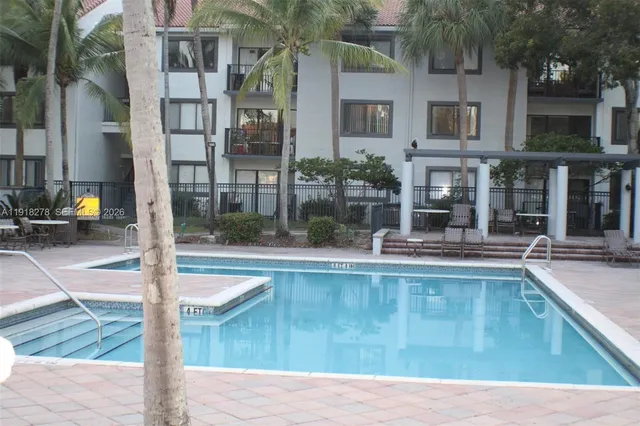 a view of pool with outdoor seating