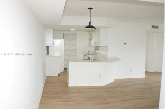 a bathroom with a sink a mirror and shower