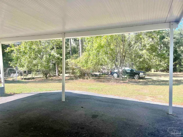 a view of an empty room with swimming pool