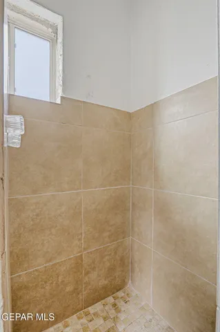 a view of an empty room and closet