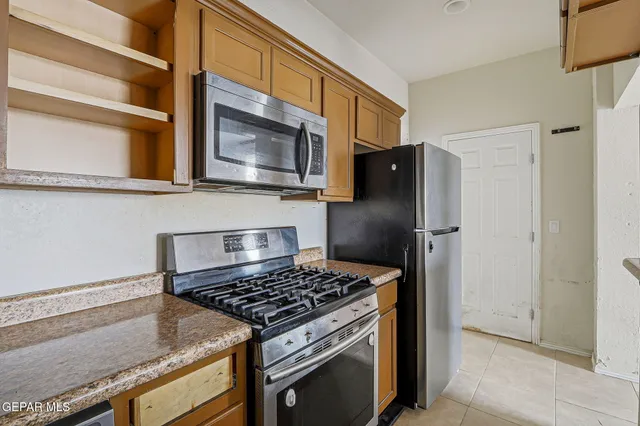 a kitchen that has a sink and a stove