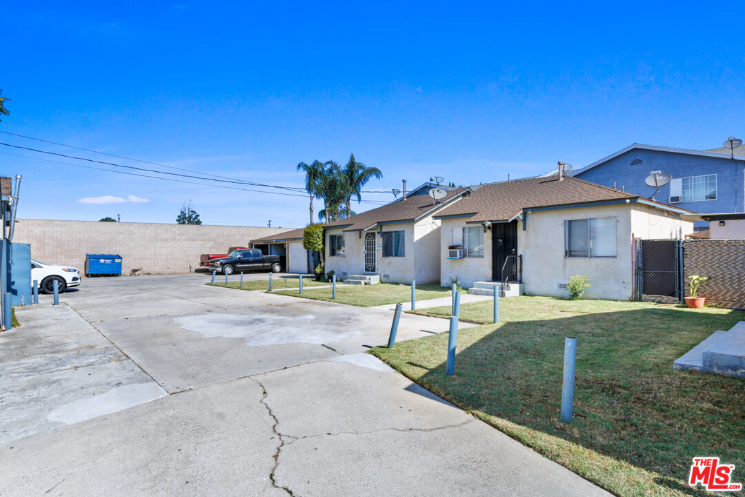 7101 Chanslor Avenue Bell, CA 90201 - Photo 6 of 20 a view of a house with backyard and a tree