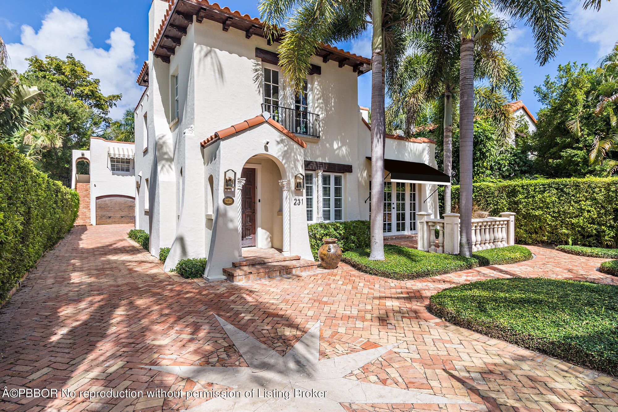 231 Sunset Road West Palm Beach, FL 33401 - Photo 1 of 22 a view of a white house with a yard and plants