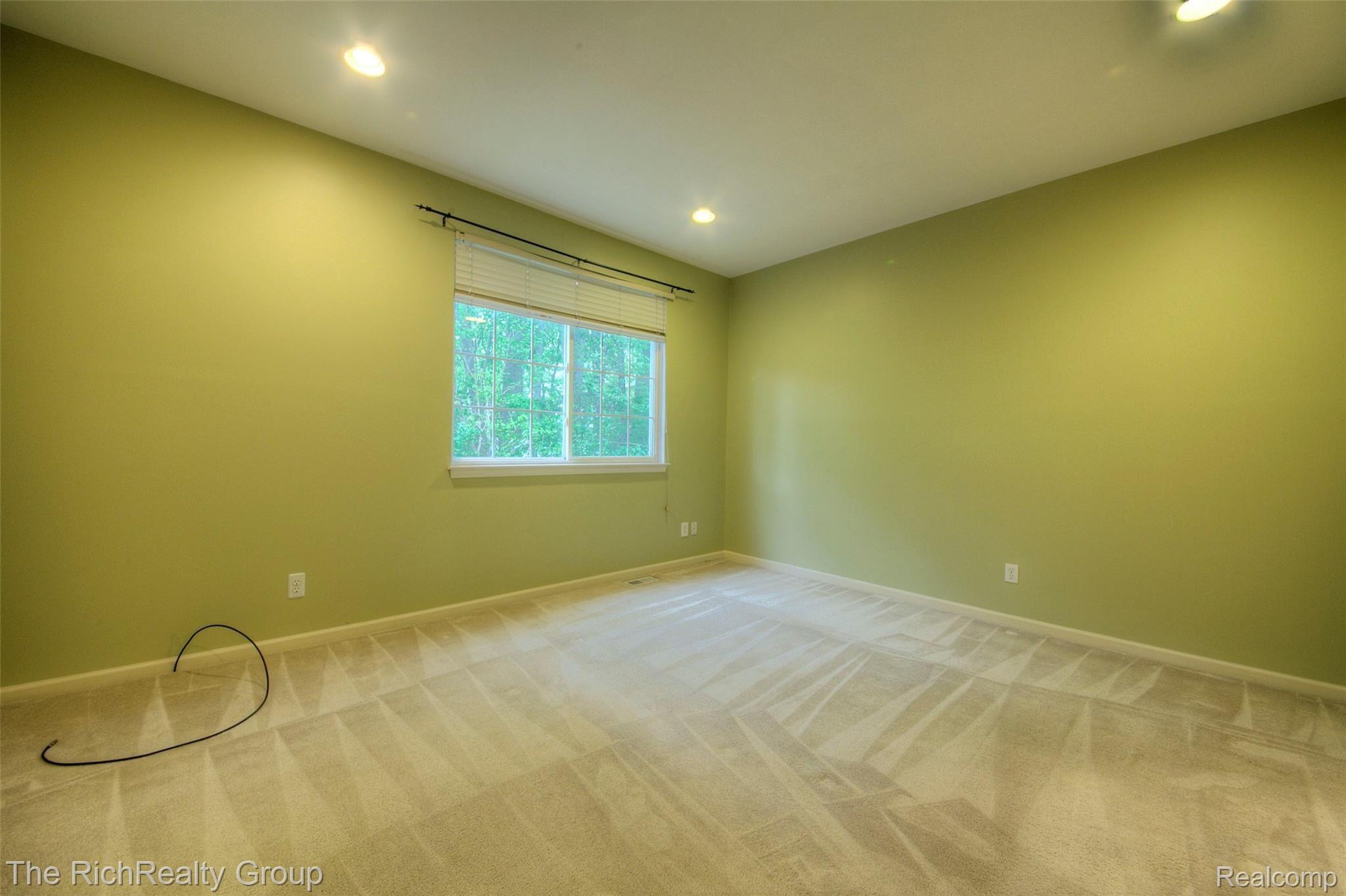 41796 Glade Road, Unit 43 Canton, MI 48187 - Photo 17 of 35 Master suite on entry level has relaxing wooded view