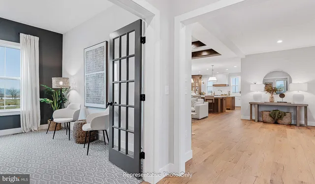 a view of a livingroom with furniture and a flat screen tv