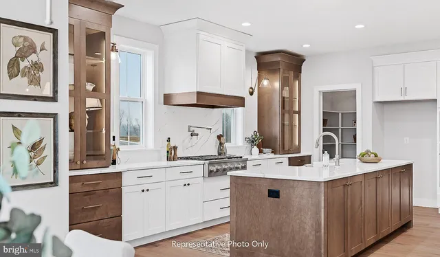 a bathroom with a sink double vanity and a mirror
