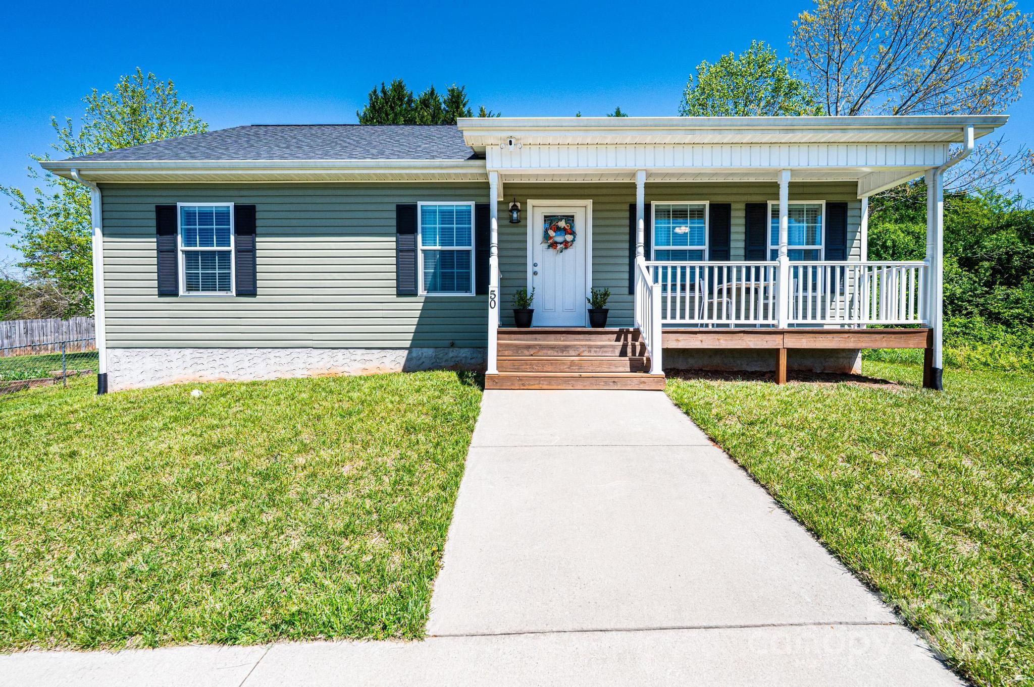 50 Serenity Lane Hickory, NC 28601 - Photo 33 of 33 a view of a house with a small yard and wooden floor and fence