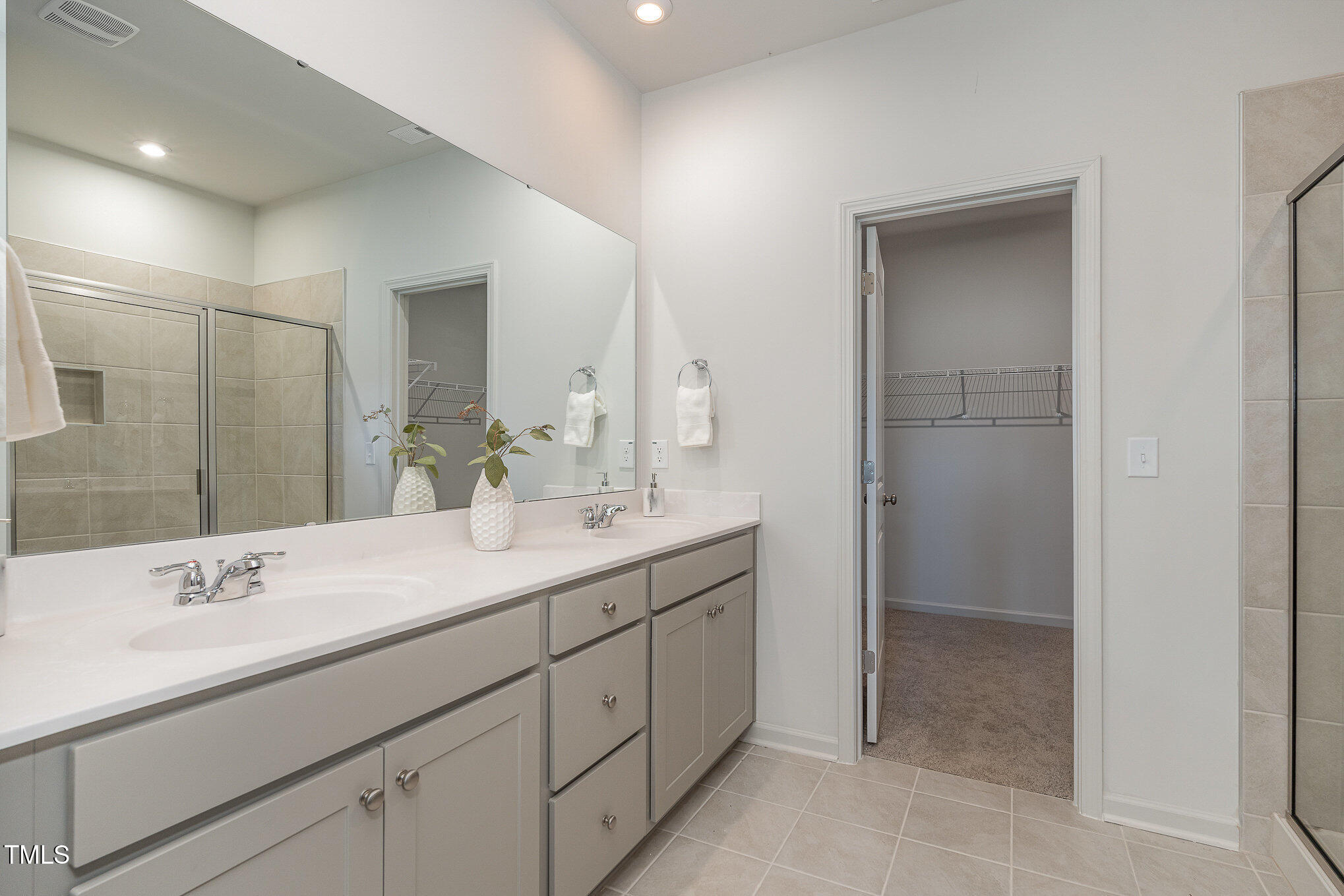 6748 Hardwick Lane Sims, NC 27880 - Photo 13 of 17 a bathroom with a double vanity sink and mirror