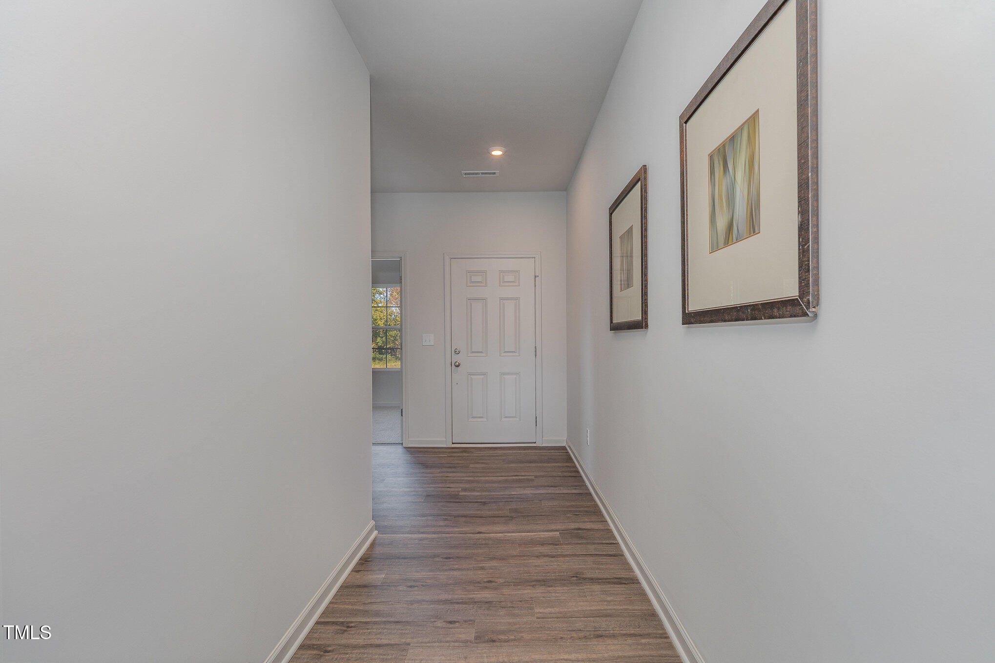 6748 Hardwick Lane Sims, NC 27880 - Photo 5 of 17 a view of a hallway with wooden floor