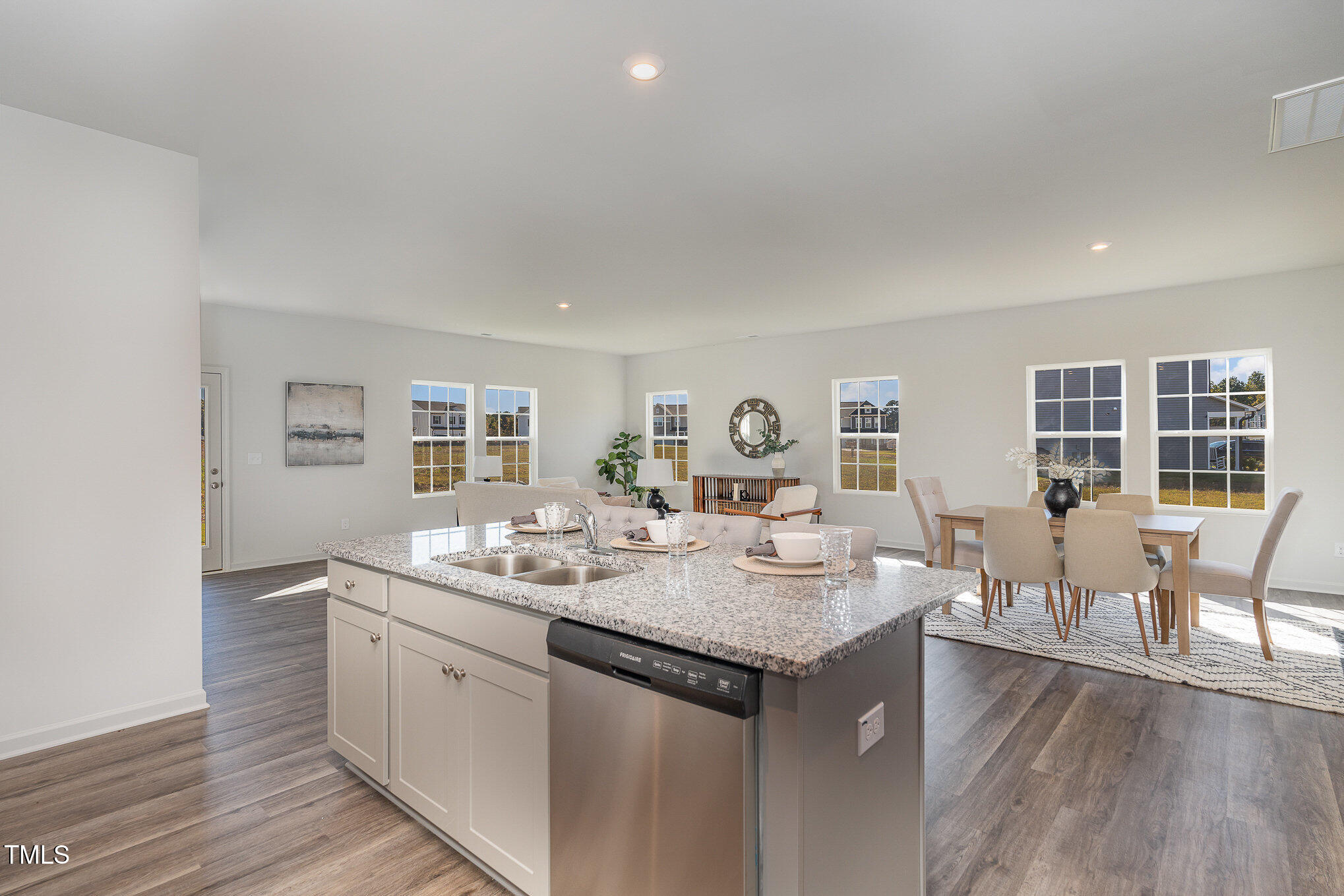 6748 Hardwick Lane Sims, NC 27880 - Photo 7 of 17 a dining hall with stainless steel appliances granite countertop a sink and dishwasher with wooden floor