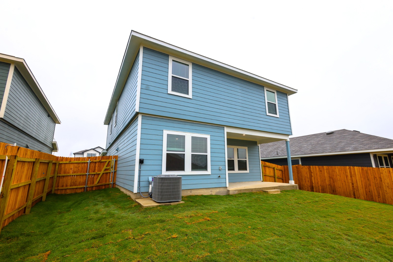 12306 Bulldogger Bend Buda, TX 78610 - Photo 11 of 11 a view of a house with backyard