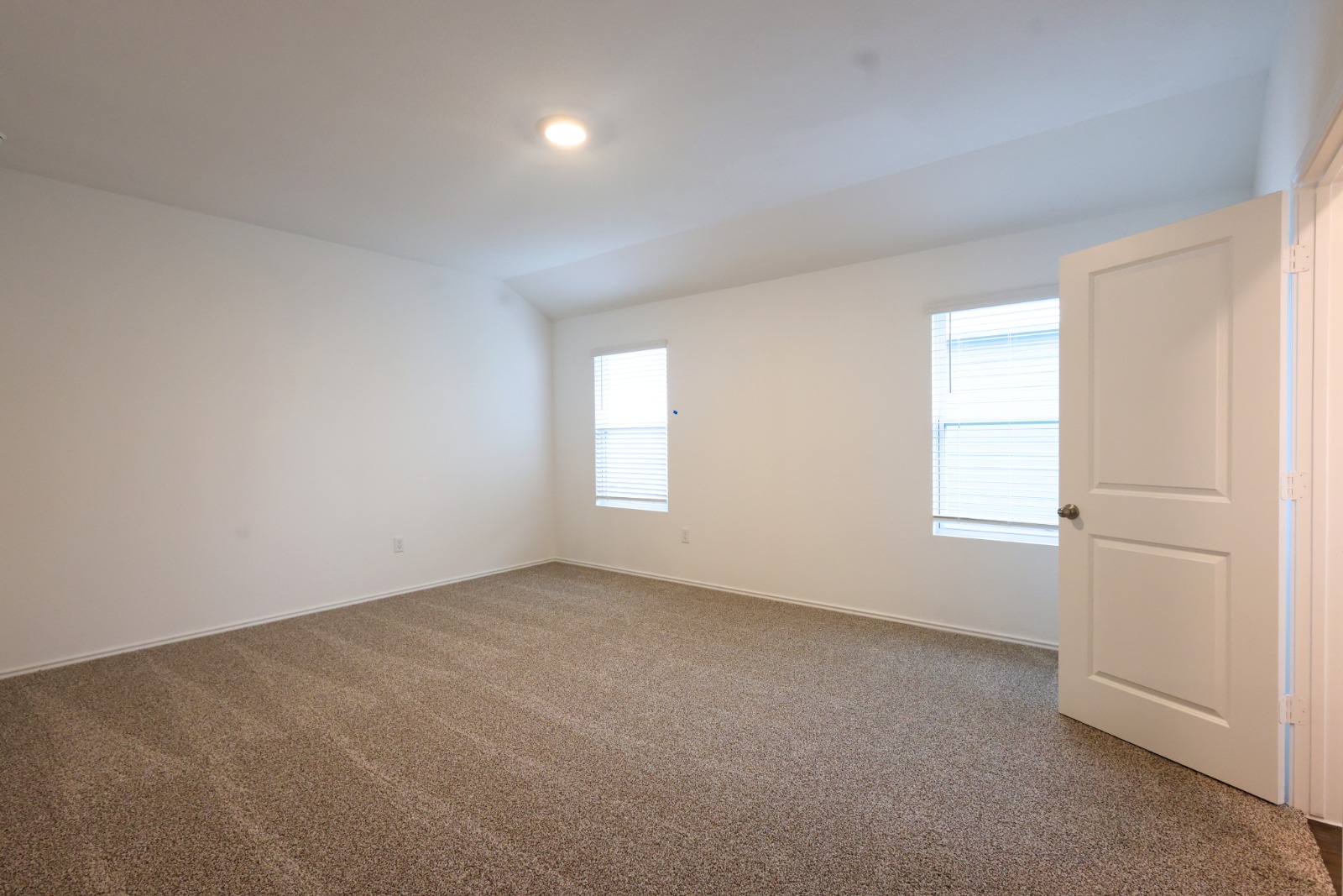 12306 Bulldogger Bend Buda, TX 78610 - Photo 6 of 11 an empty room with windows