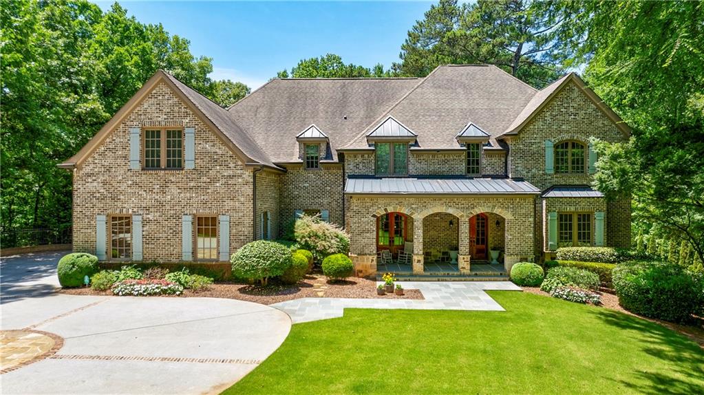 60 Burdette Road Northwest Atlanta, GA 30327 - Photo 1 of 1 a view of house with garden and tall tree