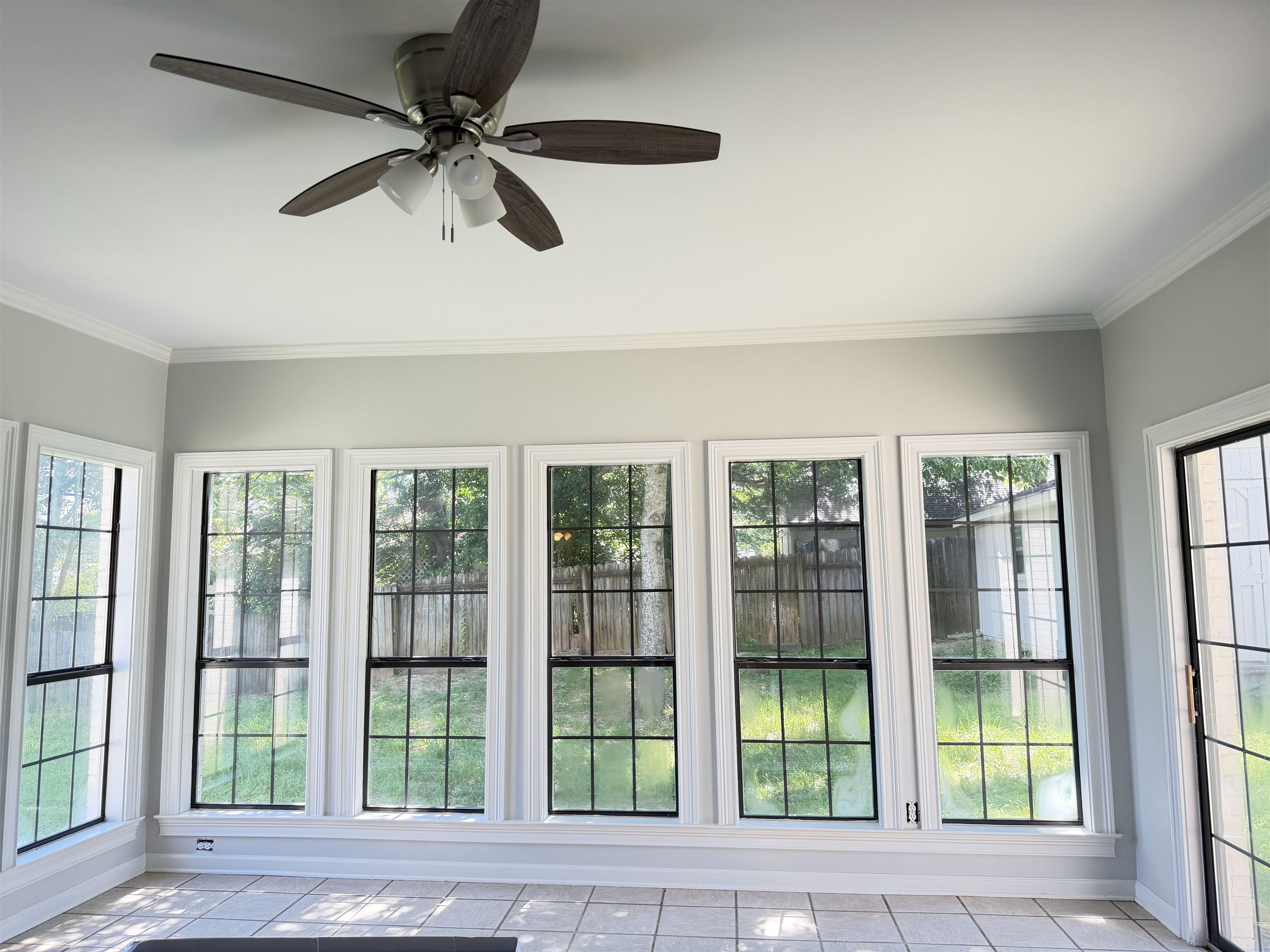 388 Park Hill Road Collierville, TN 38017 - Photo 12 of 19 Sunroom featuring a full wall of windows and a ceiling fan with integrated lighting