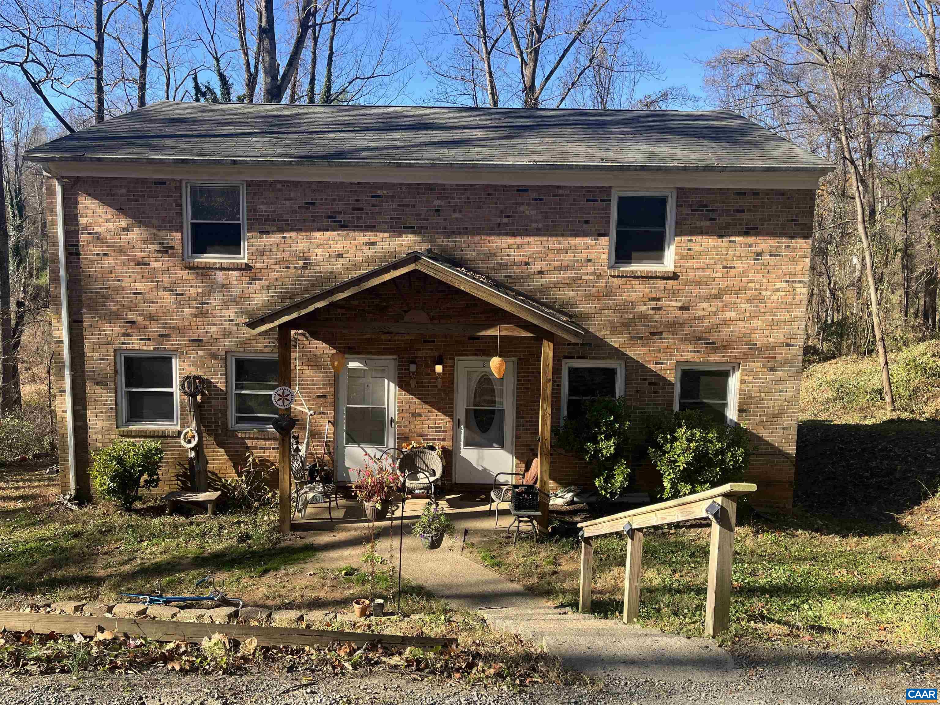 158 Buckingham Circle, Unit A&B Charlottesville, VA 22903 - Photo 1 of 23 a view of a house with patio