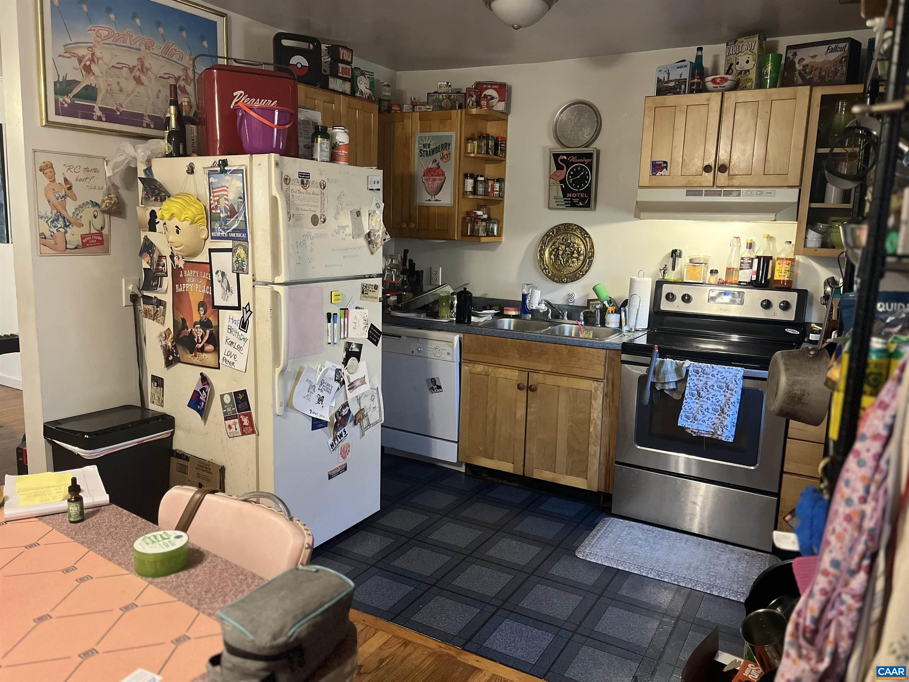 158 Buckingham Circle, Unit A&B Charlottesville, VA 22903 - Photo 10 of 23 a kitchen with stainless steel appliances granite countertop a refrigerator and a stove