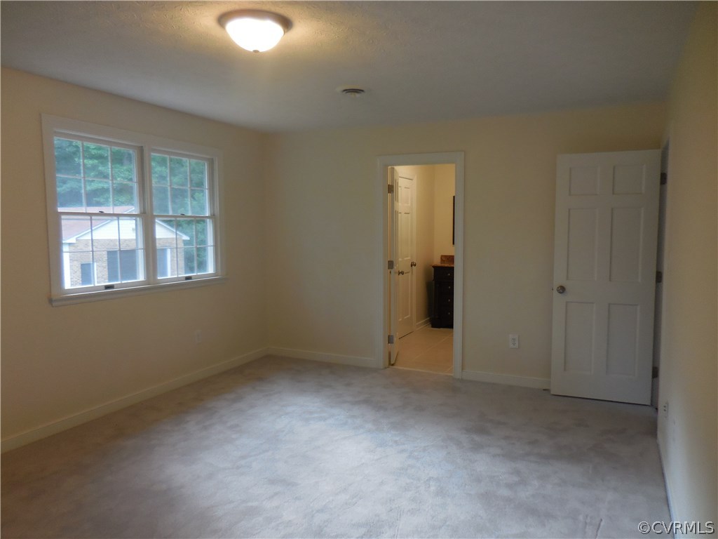 15206 Harrowgate Road Chester, VA 23831 - Photo 11 of 19 an empty room with windows