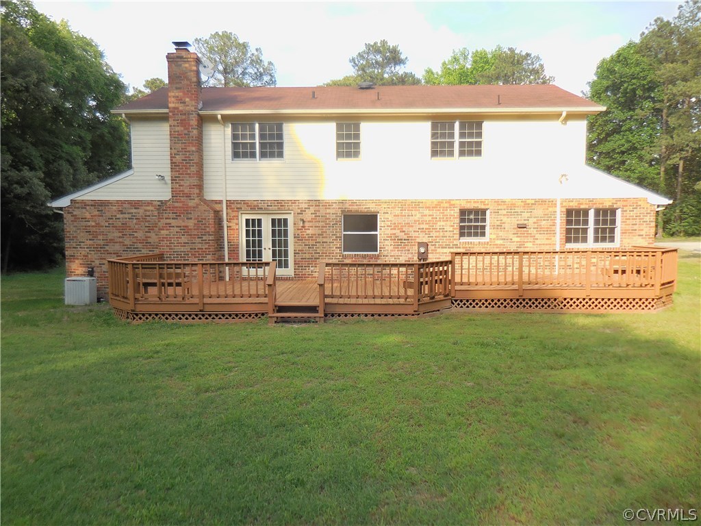 15206 Harrowgate Road Chester, VA 23831 - Photo 16 of 19 a view of a house with backyard and garden