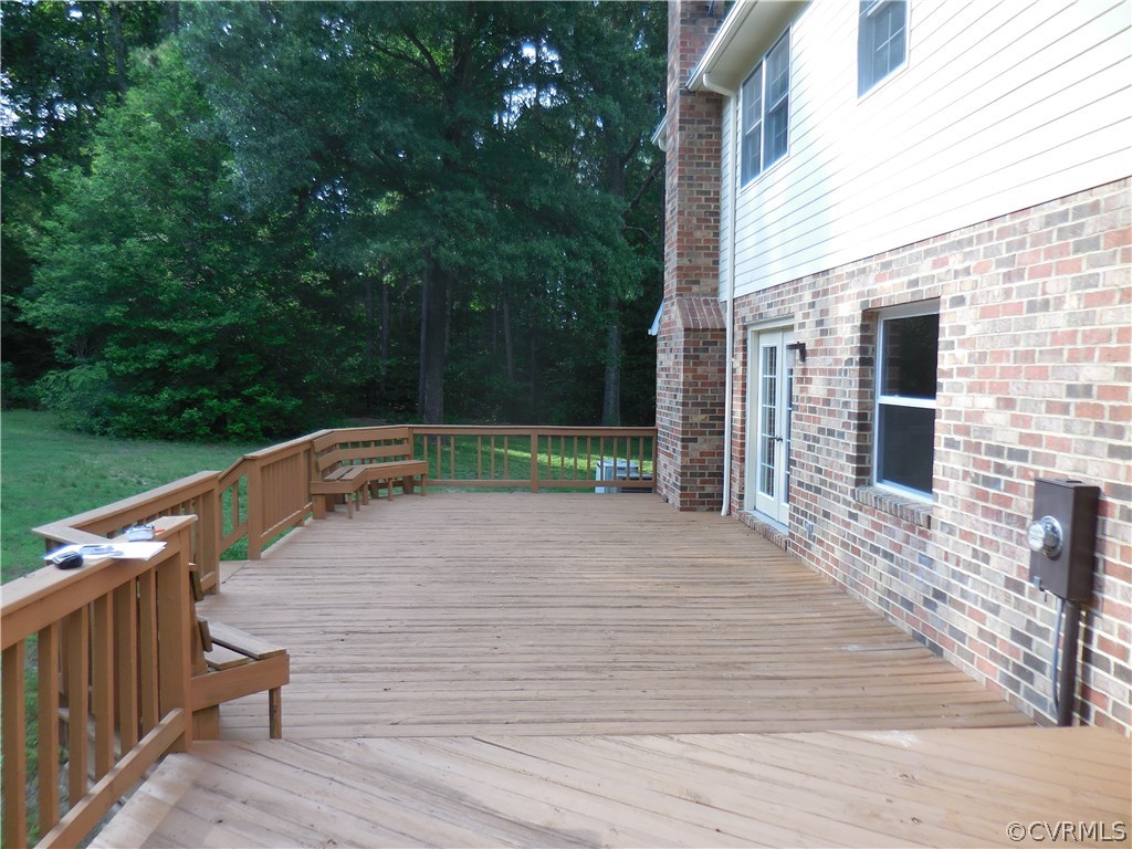 15206 Harrowgate Road Chester, VA 23831 - Photo 18 of 19 a wooden bench sitting on top of a wooden floor