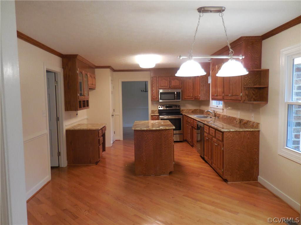 15206 Harrowgate Road Chester, VA 23831 - Photo 6 of 19 a kitchen with a sink a counter top space a stove and cabinets