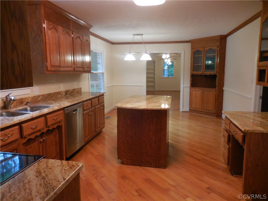 15206 Harrowgate Road Chester, VA 23831 - Photo 7 of 19 a kitchen with stainless steel appliances granite countertop a stove a sink and a refrigerator