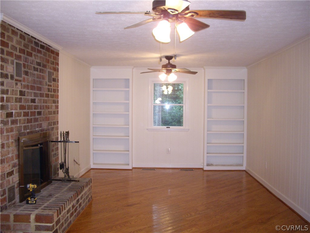 15206 Harrowgate Road Chester, VA 23831 - Photo 8 of 19 en empty room with windows and ceiling fan