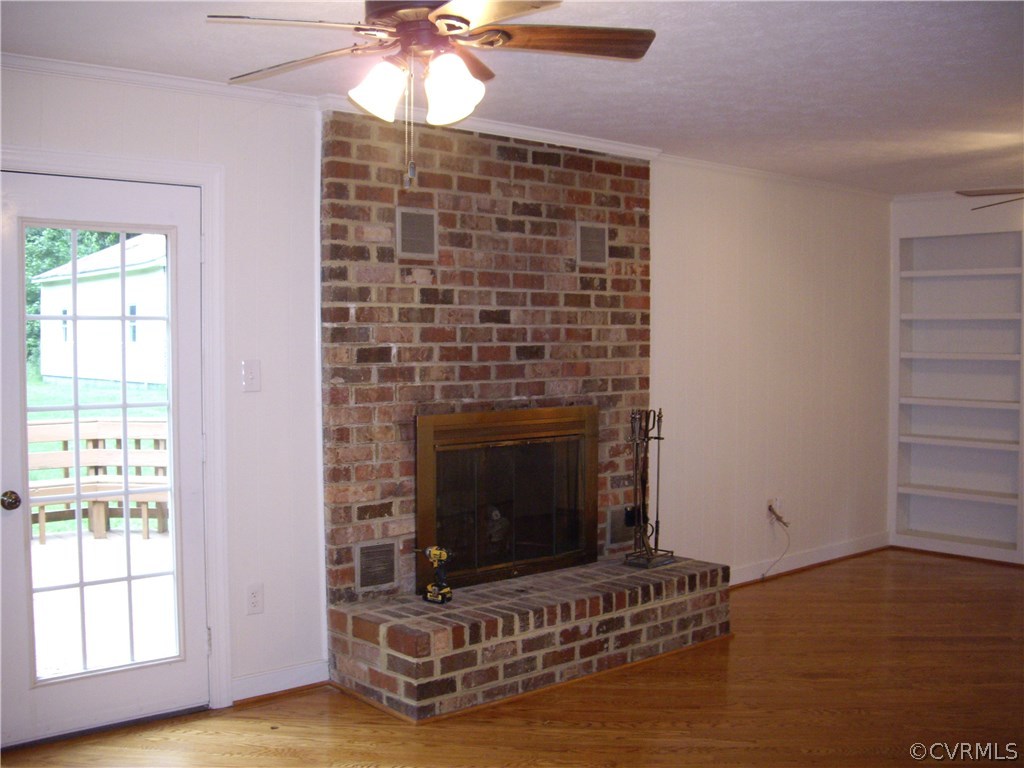 15206 Harrowgate Road Chester, VA 23831 - Photo 9 of 19 a living room with furniture and a fireplace