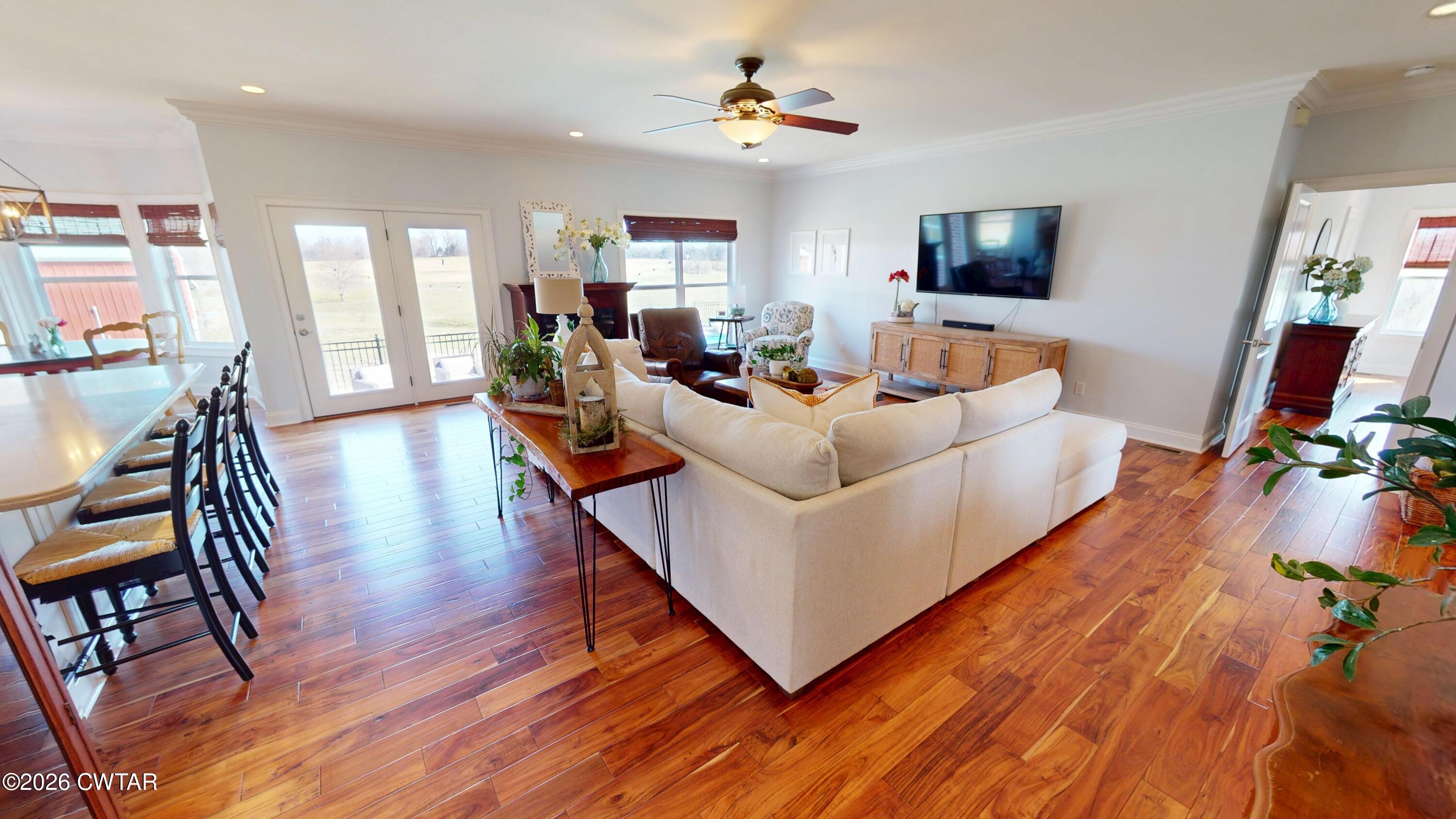 740 Gordon Road Dyersburg, TN 38024 - Photo 12 of 48 a living room with fireplace furniture and a flat screen tv