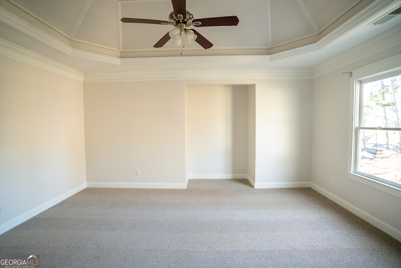 901 Custer Avenue Southeast Atlanta, GA 30315 - Photo 16 of 21 an empty room with windows and fan