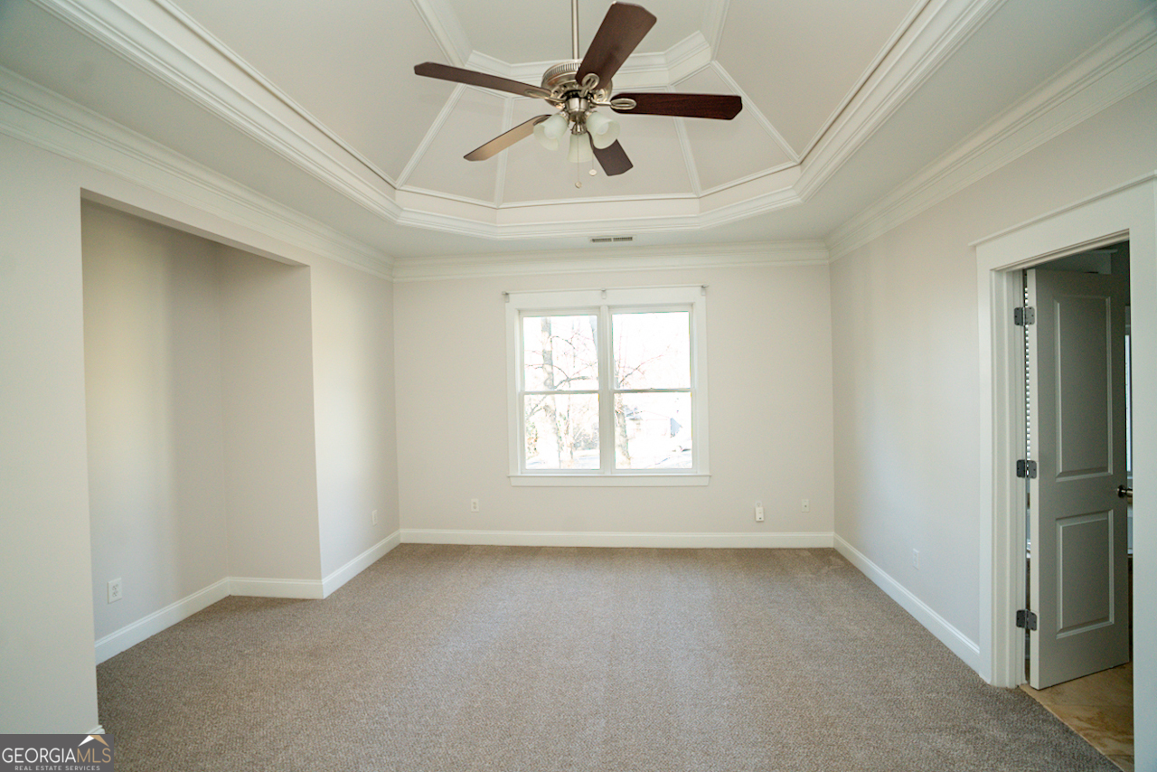 901 Custer Avenue Southeast Atlanta, GA 30315 - Photo 17 of 21 an empty room with a window and a fan