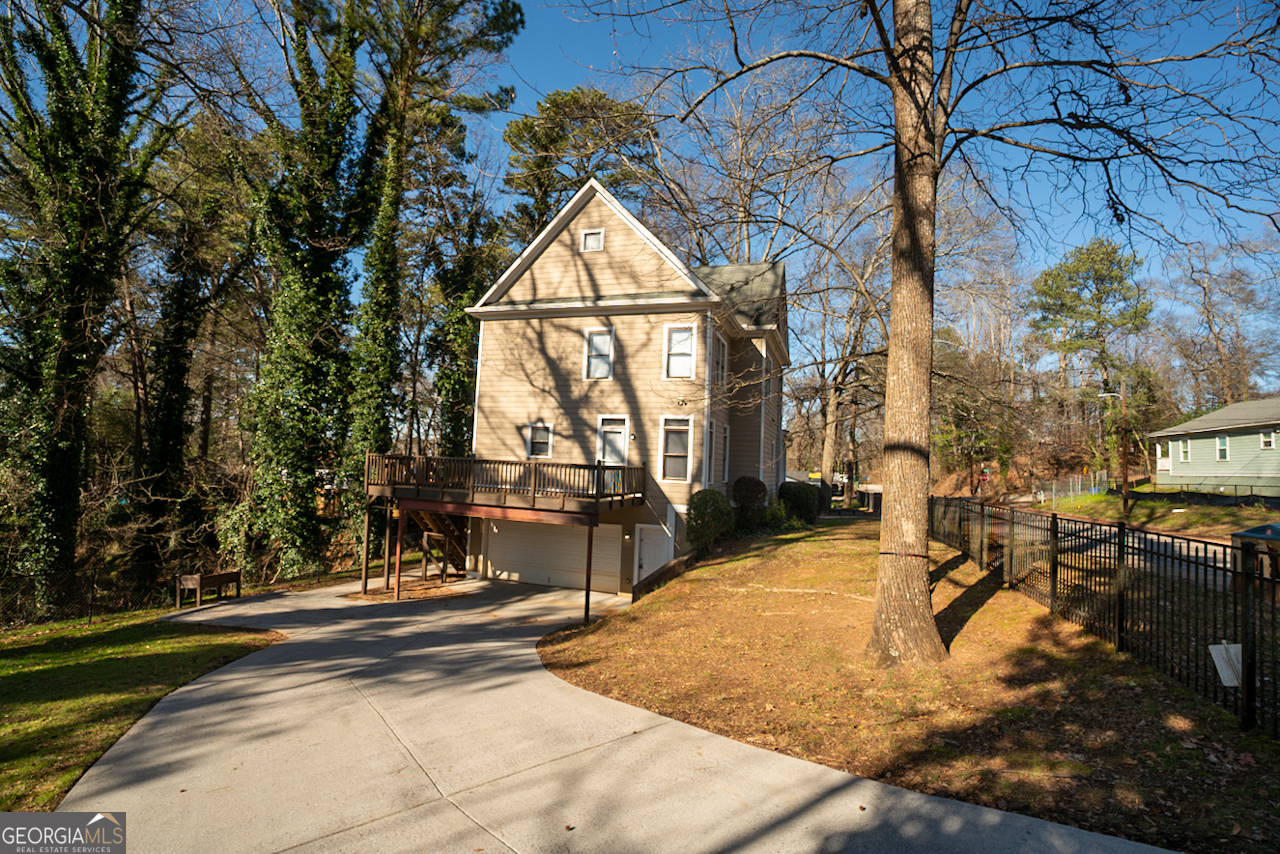 901 Custer Avenue Southeast Atlanta, GA 30315 - Photo 4 of 21 a view of swimming pool with a yard and wooden fence