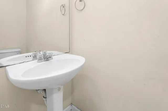 a white bath tub sitting next to a white sink