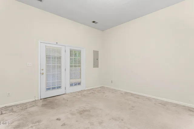 an empty room with windows