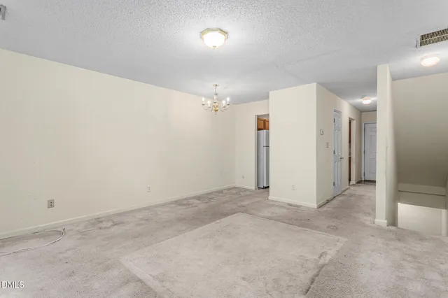 an empty room with a bathroom