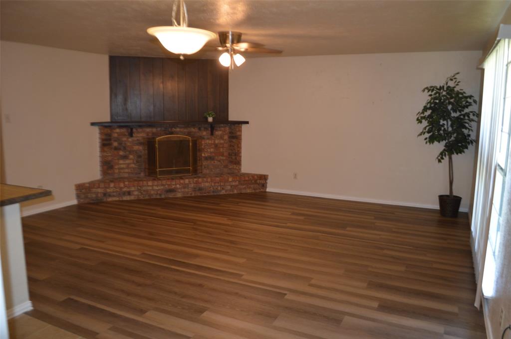5329 Strickland Avenue The Colony, TX 75056 - Photo 2 of 6 a view of a kitchen from the hallway