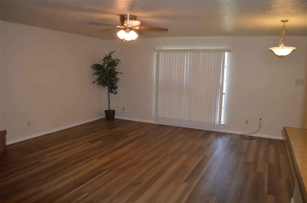 5329 Strickland Avenue The Colony, TX 75056 - Photo 3 of 6 a view of empty room with wooden floor and fan