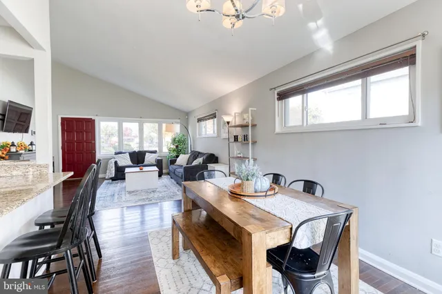 a view of a dining room with furniture and a window