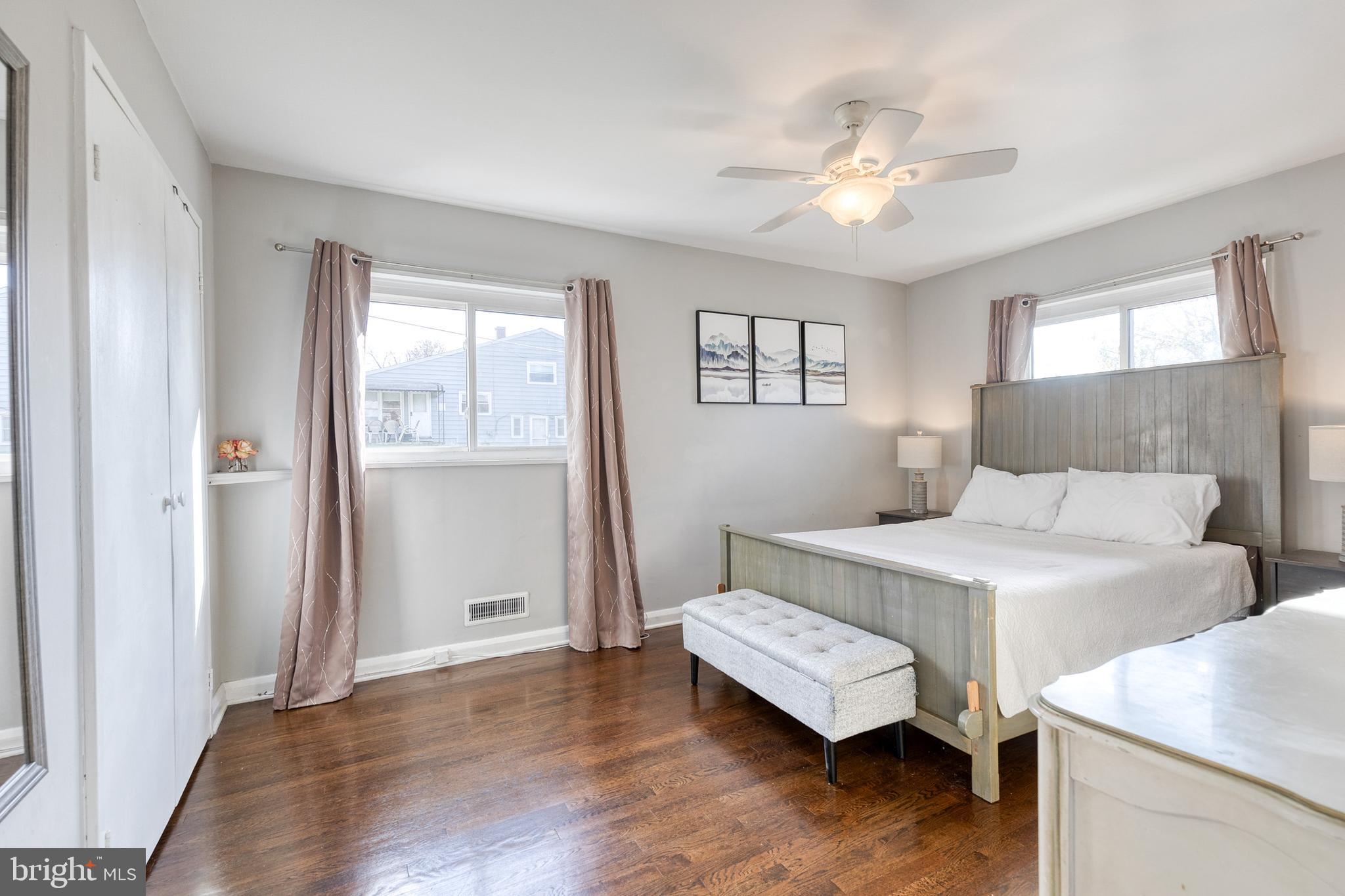 913 Marksworth Road Catonsville, MD 21228 - Photo 18 of 36 a bedroom with a bed and a chandelier