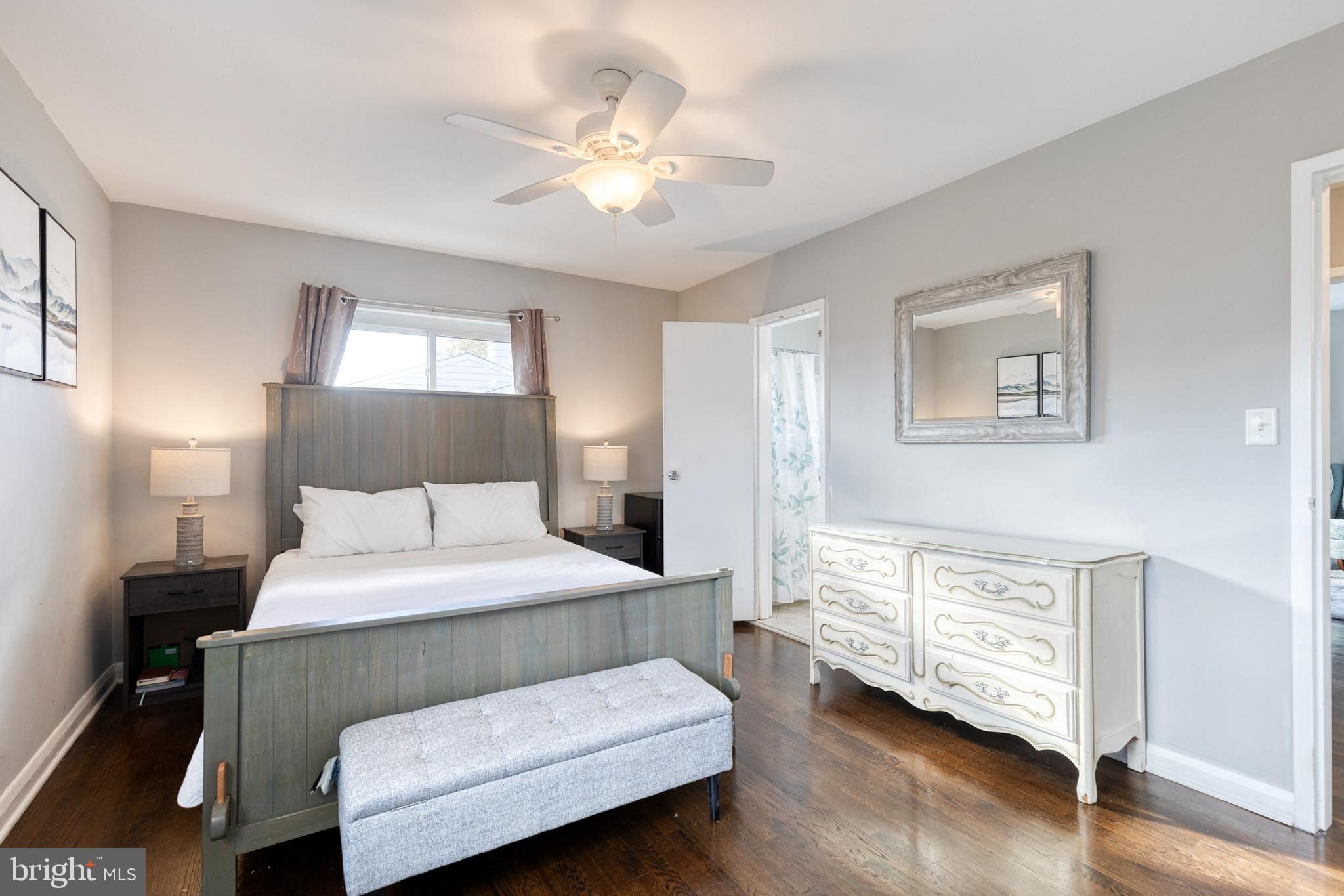 913 Marksworth Road Catonsville, MD 21228 - Photo 20 of 36 a bedroom with a bed and a chandelier