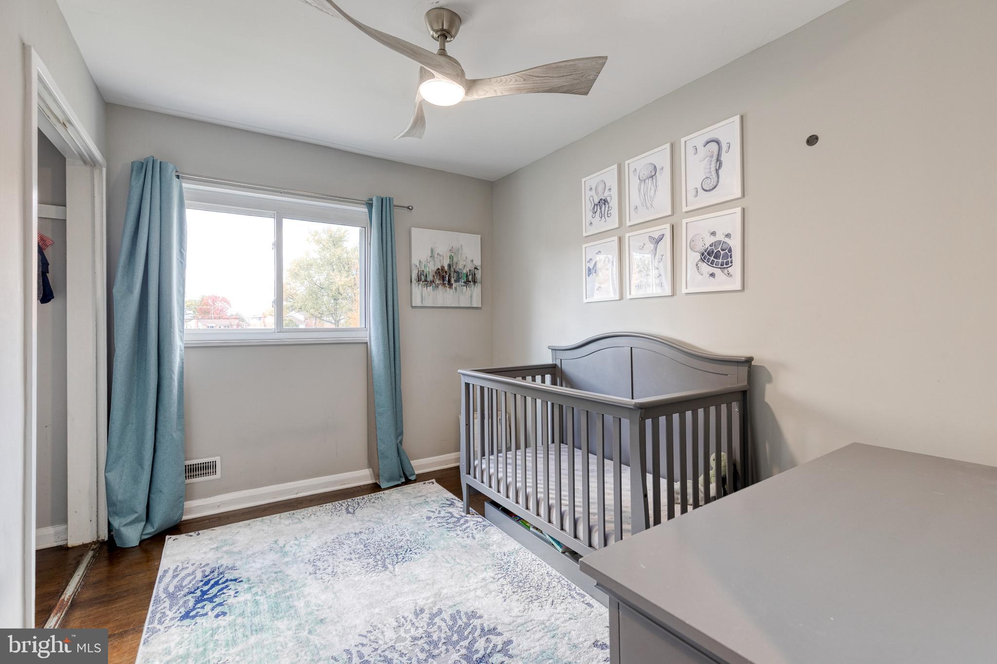 913 Marksworth Road Catonsville, MD 21228 - Photo 23 of 36 a bedroom with a bed and a window
