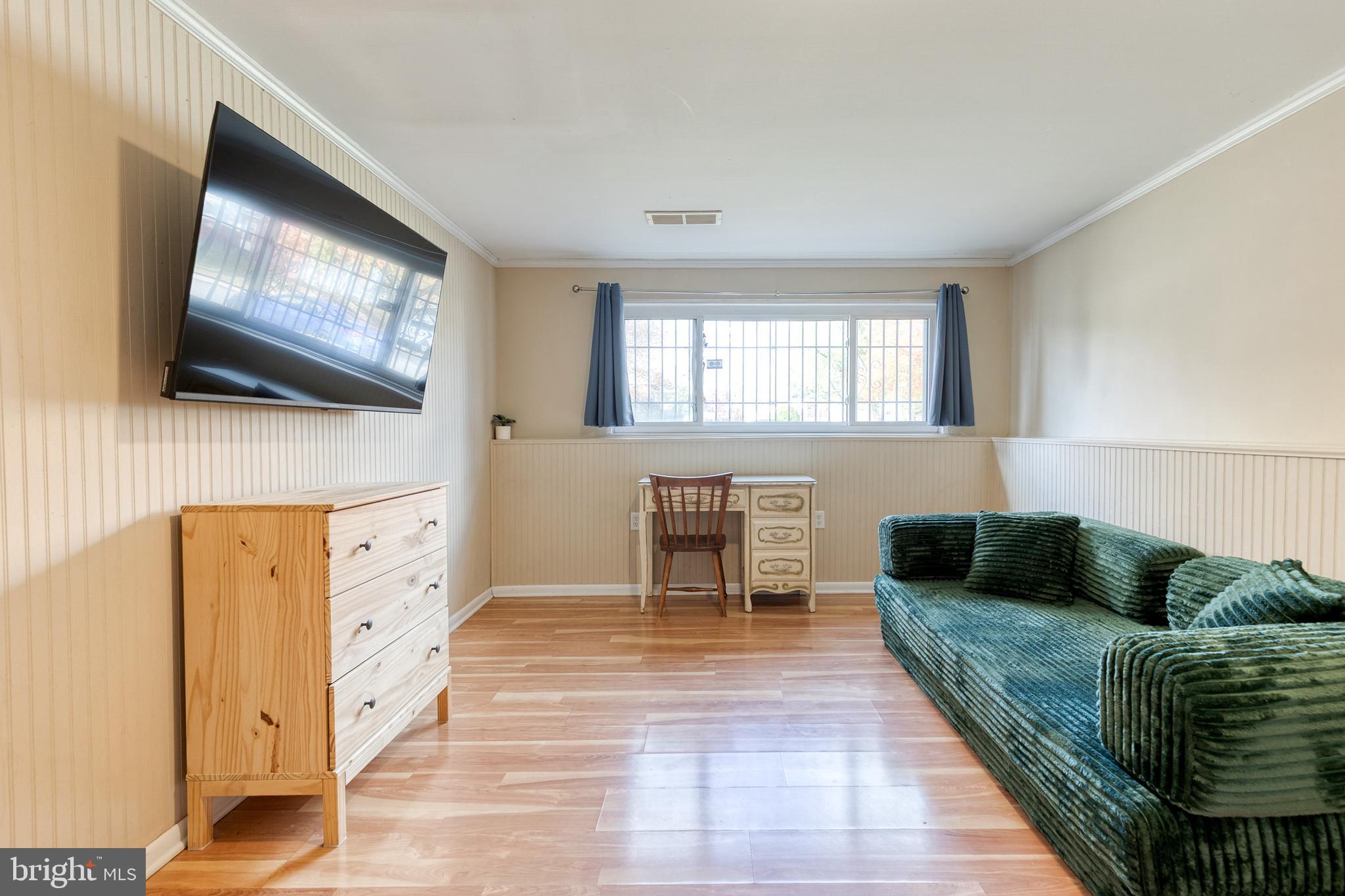 913 Marksworth Road Catonsville, MD 21228 - Photo 28 of 36 a living room with furniture and a flat screen tv