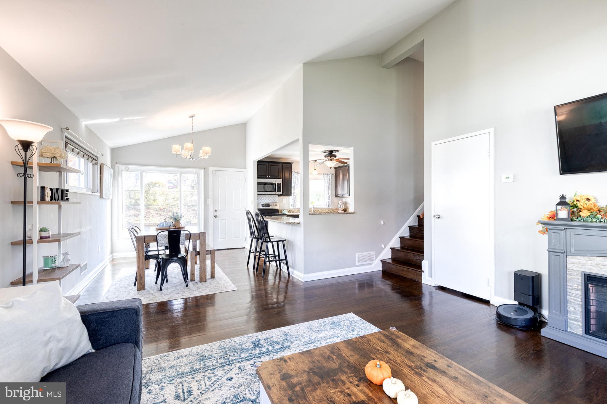 913 Marksworth Road Catonsville, MD 21228 - Photo 3 of 36 a living room with furniture and a fireplace